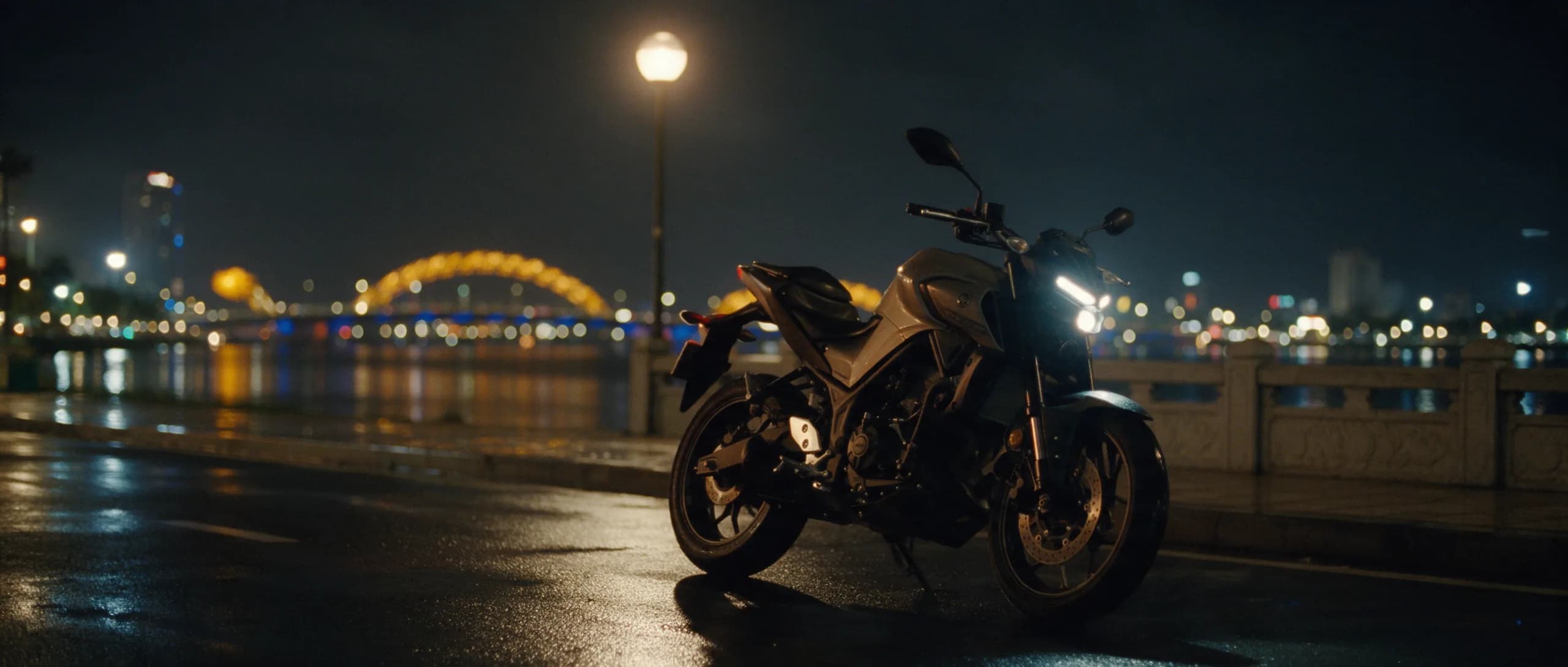 Yamaha MT-03 parked outside a small coffee shop on a Da Nang street in the early morning