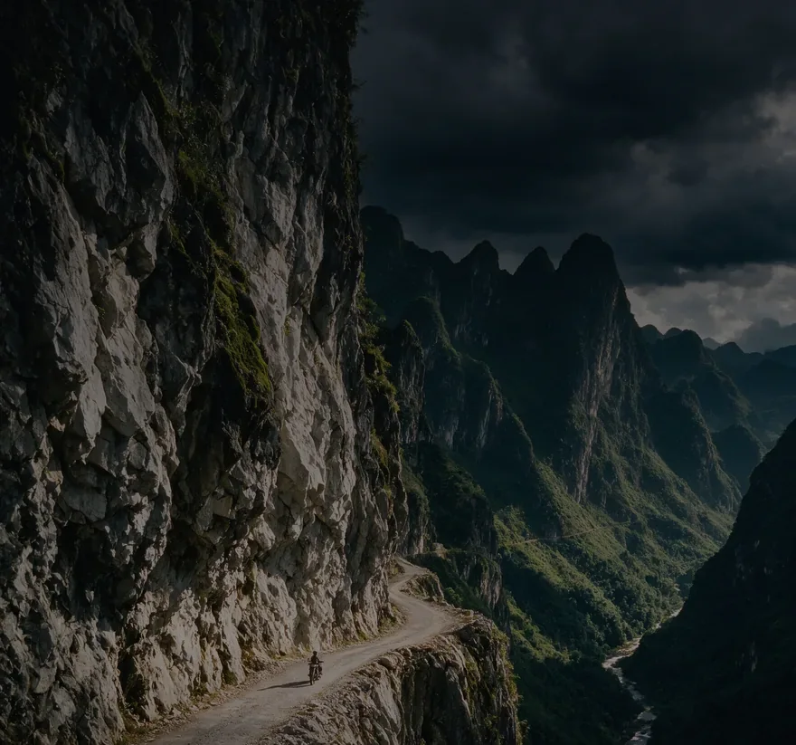 EastRide promo: a rider and a Royal Enfield by a mountain lake, a road at sunset from the handlebars, a helmet on a wall against the hills